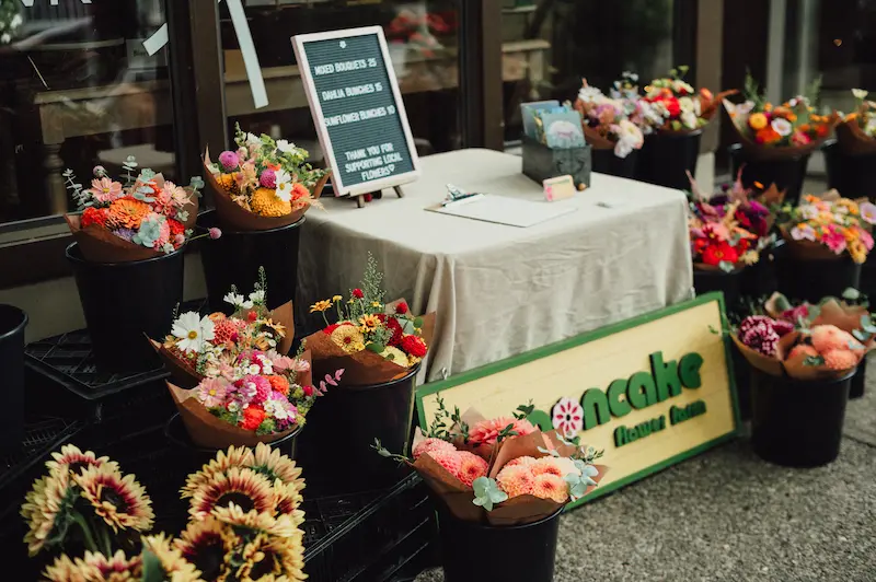 Colorful mixed flower bouquets for sale from Pancake Flower Farm at a sidewalk stand in Downtown Camas.