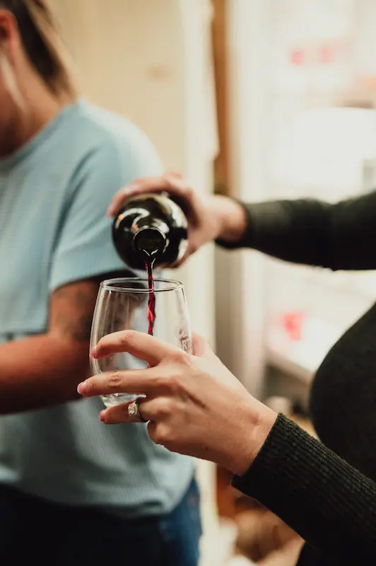 Close-up of red wine being poured into a souvenir glass for an attendee in Downtown Camas, Washington.